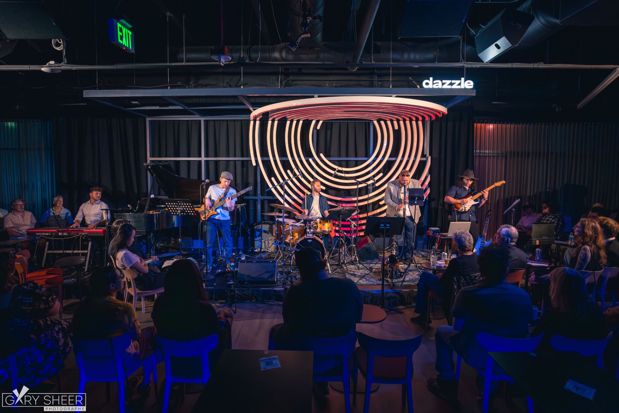 Jordan Lovinger performing at a corporate event