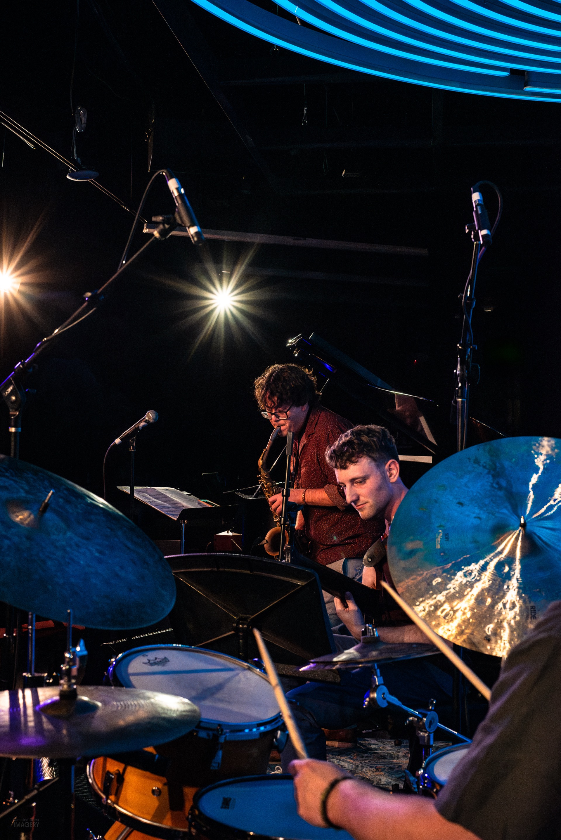 Chick Magnet trio performing at Dazzle Denver, view from behind the drums