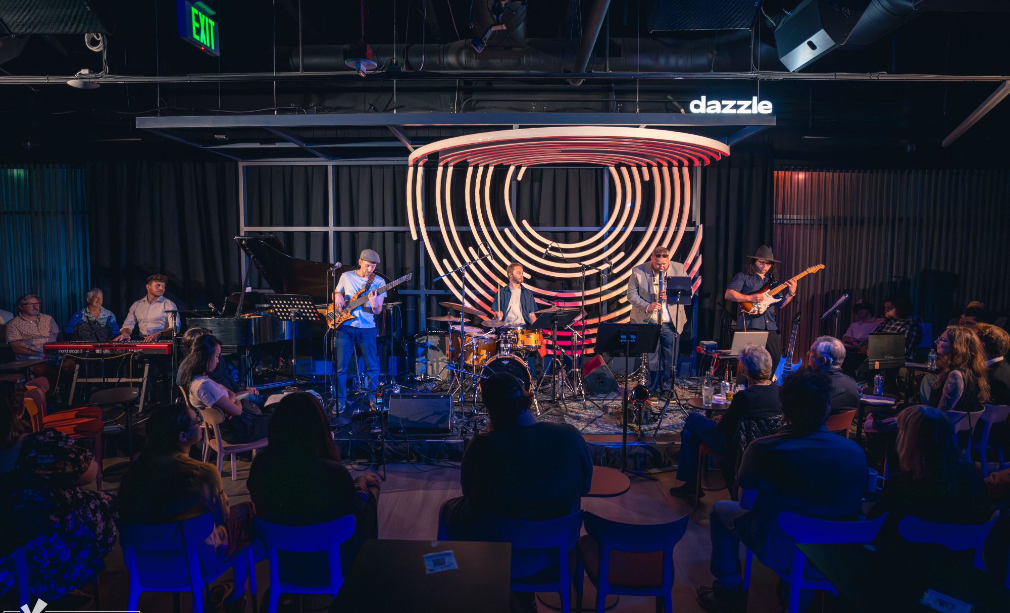 Jordan Lovinger and band performing to a packed audience at Dazzle Denver